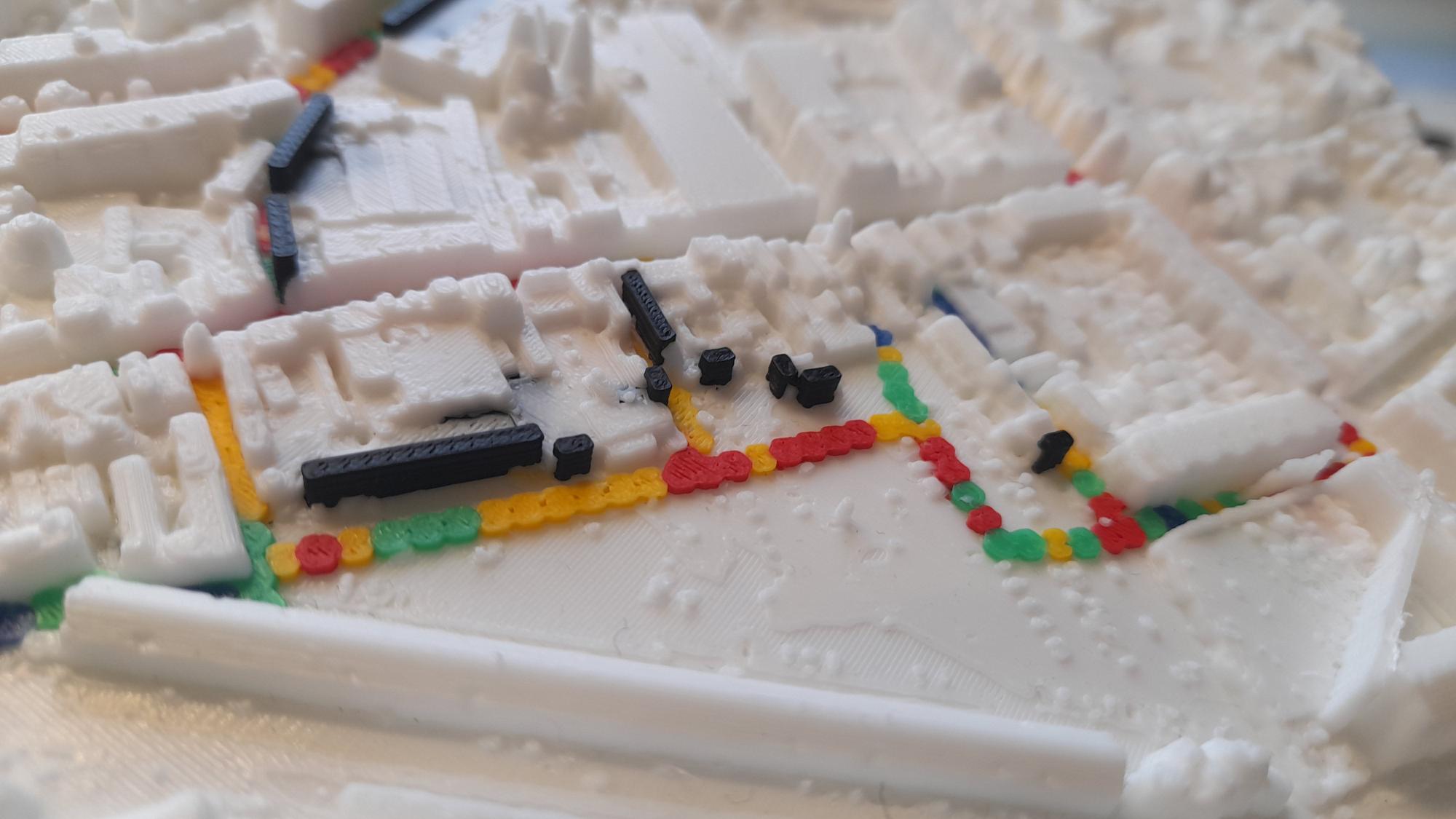The same area on the 3D-printed model, with the murals in black and the route coloured by emotional arousal
